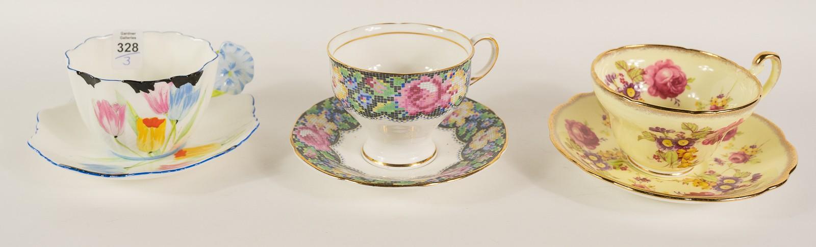 THREE CUPS AND SAUCERS