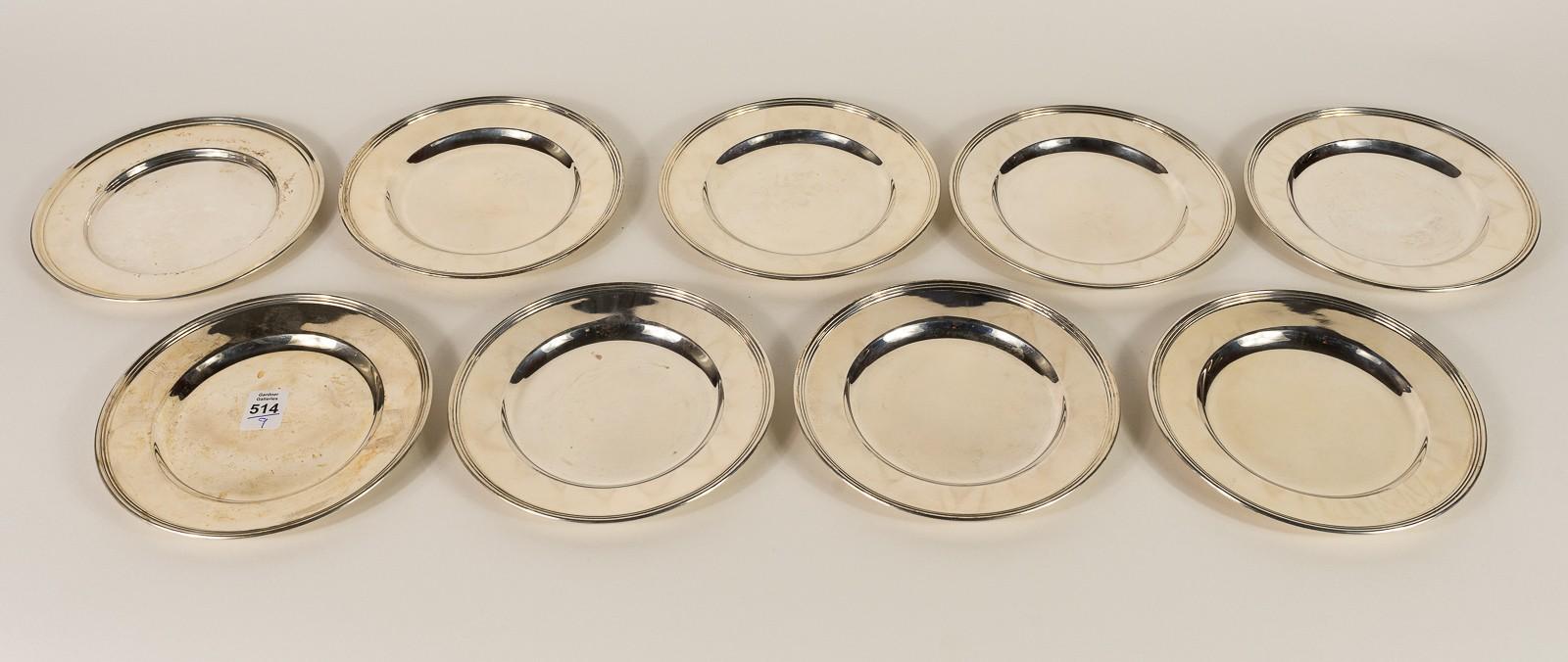 NINE STERLING BREAD AND BUTTER PLATES