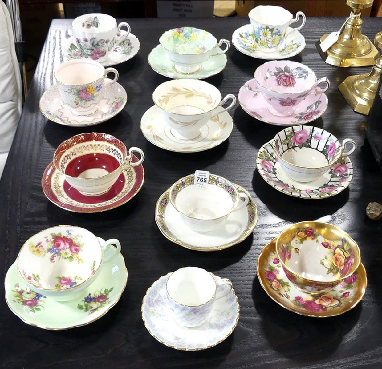 TWELVE CUPS AND SAUCERS