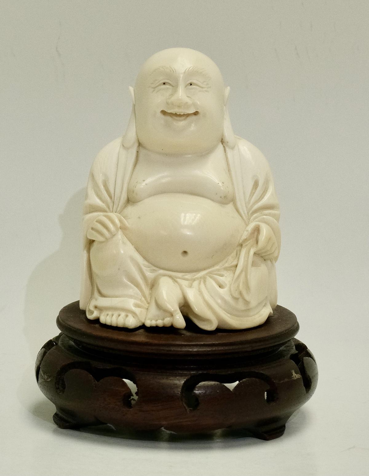 small carved ivory buddha