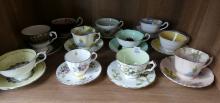 ELEVEN ENGLISH CUPS AND SAUCERS