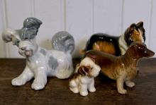 FOUR DOG FIGURES