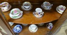 TWELVE CUPS AND SAUCERS