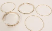 SEVEN SILVER BRACELETS