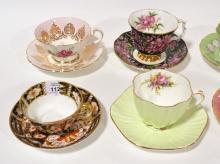 EIGHT CUPS AND SAUCERS