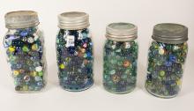 FOUR JARS OF MARBLES