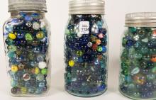 FOUR JARS OF MARBLES