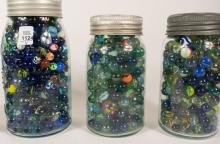 FOUR JARS OF MARBLES