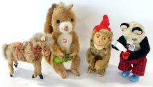 FOUR VINTAGE WIND-UP TOYS