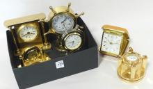 SIX CLOCKS AND MEASURING TAPE