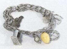 STERLING CHARM BRACELET, TWO COINS AND SPOON