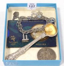 STERLING CHARM BRACELET, TWO COINS AND SPOON