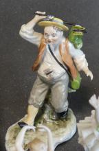 FIVE PORCELAIN FIGURINES