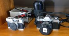 THREE CAMERAS AND FOUR LENSES