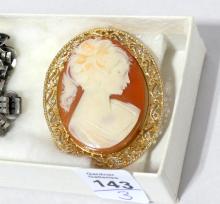 SILVER LOCKET AND TWO CAMEO BROOCHES