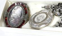 SILVER LOCKET AND TWO CAMEO BROOCHES