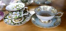 FOUR ENGLISH CUPS AND SAUCERS