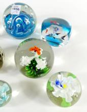 EIGHT PAPERWEIGHTS