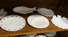 TWELVE FIGURAL MILK GLASS PLATES