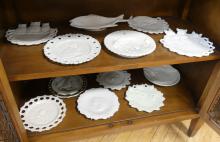 TWELVE FIGURAL MILK GLASS PLATES