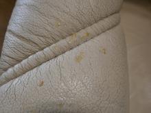 STRESSLESS LEATHER RECLINER AND FOOTSTOOL