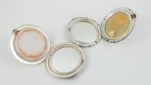 TWO STERLING COMPACTS