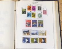 BRITISH STAMPS AND LOON FIGURINE