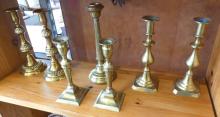 FOURTEEN BRASS CANDLESTICKS