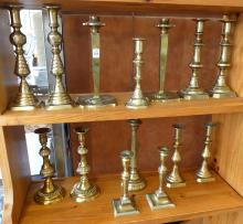 FOURTEEN BRASS CANDLESTICKS