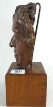 BRONZE FACE ON DISPLAY STAND