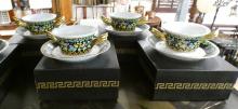 EIGHT VERSACE BOUILLON CUPS WITH SAUCERS