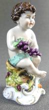 PORCELAIN FIGURINE OF YOUNG BACCHUS