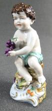 PORCELAIN FIGURINE OF YOUNG BACCHUS