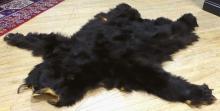 BLACK BEAR RUG AND SEAL SKIN RUG