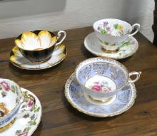 NINE CUPS AND SAUCERS