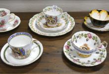 NINE CUPS AND SAUCERS