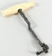 IVORY HANDLED TOOTH KEY