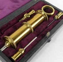 GILT BRASS EYE SYRINGE