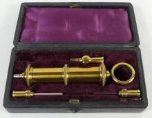 GILT BRASS EYE SYRINGE