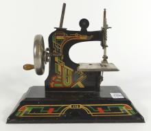 ANTIQUE TOY SEWING MACHINE & CAST IRON STOVE