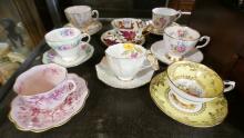 EIGHT ENGLISH CUPS AND SAUCERS