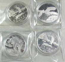 FOUR $50 SILVER COINS