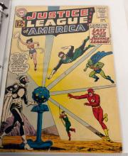 BINDER OF JUSTICE LEAGUE COMIC BOOKS