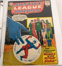 BINDER OF JUSTICE LEAGUE COMIC BOOKS