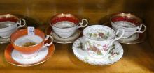 EIGHT CUPS AND SAUCERS