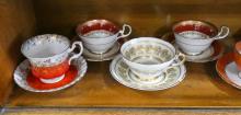 EIGHT CUPS AND SAUCERS