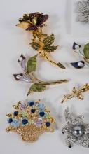 SIXTEEN FLORAL FASHION BROOCHES