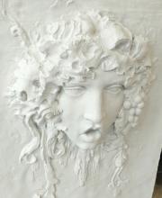 TWO PLASTER WALL PLAQUES