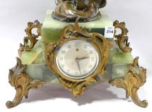 ONYX AND ORMOLU CLOCK WITH SPELTER SCULPTURE