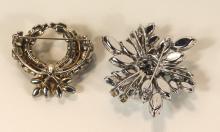 TWO SHERMAN BROOCHES